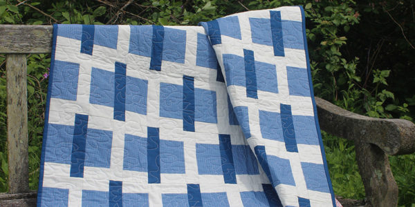 Studio R Quilts Sticks and Stones quilt on a park bench. Skill Builder - Quilt patterns to help you build quilting confidenc.