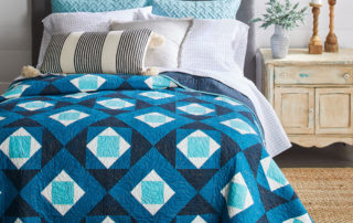 Winter Frost Quilt, Styled on Bed, Quilts & More Magazine Winter 2021 Issue